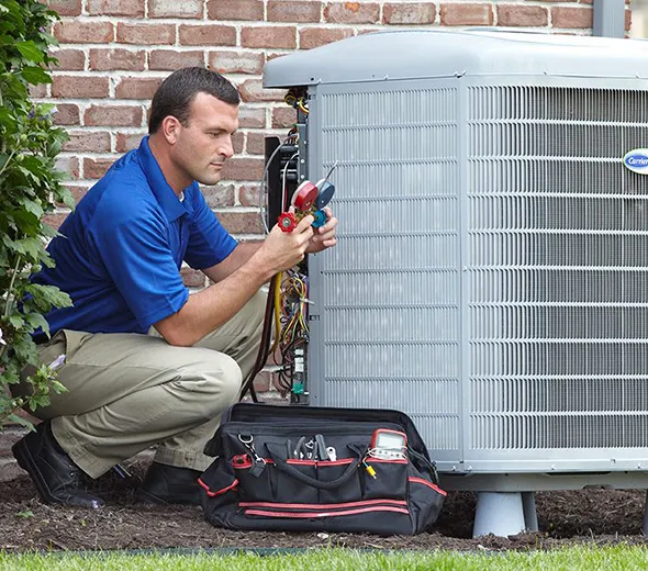 Skilled technician checking on a tool to ensure accurate HVAC repairs.